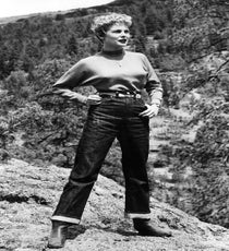 Denim As The Great Equalizer
As most classic jeans brands have told us over and over again, denim started out as an inexpensive and durable material made for the working classes. Yet, in the '50s, the narrative changed, with "outsiders" using the blue-collar associations of denim to mean something cool and anti-conformist. Dincuff suggests that, "Up until this point, denim belonged to the workers. But then you had Elvis and Marlon Brando recasting the jean as a cool, outsider material. It was a movement that belonged to teenagers."
"Girls weren't allowed to wear jeans to high school, so it was particularly taboo for women," she goes on to say. "But in the '60s, along with the beatniks, jeans helped usher in androgyny, and there was a move toward genderless fashion." With blue jeans, men and women were beginning to dress not just similarly, but in the style of the worker — which signified counterculture. As Marshall McLuhan famously put it, "Jeans represent a ripoff arid a rage against the establishment."
Photo: Everett Collection/ Rex USA blue-jeans