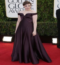Lena Dunham
Hey girl, hey! Although season two of Lena Dunham's Golden Globe-winning HBO show premiered during the actual awards, Dunham arrived at the red carpet looking nothing short of chic. Clad in the most decadent plum-purple, we loved the details of Zac Posen's décolletage-baring number. Her stylist, Brad Goreski, must've known that the cinched waist would hug her curves in all the right places and that the off-the-shoulder neckline was prime tattoo-exposing material. If there was ever a dress that could define Dunham, this is it!
Photo: Rex/Rex USA rexusa_1196652gl