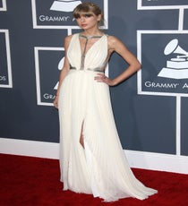 Taylor Swift
Taylor Swift has made quite a point of sweeping, low-cut, white gowns of late — to the point that if she gets married anytime soon, we're gonna need some extra signage to make it quite clear we're not look at just any old red carpet. But, we can't really blame her, as she continues to look stunning time after time. Her flowing J. Mendel getup last night was just the right amount of strappy, sequined, goddess-y goodness.
Photo: Jim Smeal/BEImages Taylor Swift - Grammys 2013