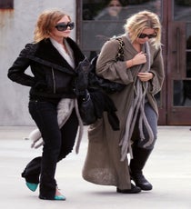 Mary-Kate/Ashley Olsen & Hobo-Style Boho
The tabloid press used to call them "bag ladies," and for a moment there, we were right along with them. But then we warmed to this luxe, oversized take on the old-boho style, realizing that these young ladies were playing with their physical size and financial might in a particularly fashionable, amusing way. Suddenly, we looked around, and everyone's coats were scraping the pavement...even ours. To this day, whenever one of our staffers saunters into the office with hangover-blocking shades on, a two-sizes-too-big cardi, and a Venti latte, we say, "Good morning, MK!"
Photo: Flynet Pictures, Inc. mary-kate-ashley