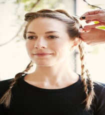 Step 6: Begin wrapping the twists counter-clockwise around the crown of the head, securing with bobby pins as you go. style1_step6