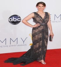 Just when we thought we'd never be able to shake the image of Anna Chlumsky as My Girl's Vada Sultenfuss, the Veep star gave us a gorgeous snapshot to replace it with in a custom
Christian Siriano gown equipped with vintage lace, Stuart Weitzman strappy sandals, a Judith Leiber clutch, and Neil Lane baubles. Photo: Matt Baron/BEImages emmys-dresses-anna-chlumsky