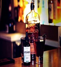 By far the most intense-looking drink of the bunch, the "Bloody Sorro” is the creation of Smith Commons' bartender Parish Bradley. Not taking Halloween too literally, Parish instead drew inspiration from the otherworldly shape and color of candied hibiscus flowers to create a beautiful (but freaky) concoction. This bourbon-based all-spirits cocktail uses housemade hibiscus tea-infused vermouth, hibiscus syrup from the candied flowers, and bitters. At first, you’ll taste the herbaceous hibiscus flower, balanced out by the sweetness of the syrup, and the result is as satisfying as it is warming. Don’t shy away from the “creature” perched on the side of the glass, either — that candied hibiscus flower is edible, and it doesn’t bite back (we think). Watch Bradley make the "Bloody Sorro” here, and snag the recipe below:
1 ounce hibiscus tea-infused vermouth (made by muddling a hibiscus tea bag with vermouth)
1/2 ounce hibiscus syrup
2 ounces Bulleit bourbon
3 drops Bittermens Boston Bittahs
Fill a cocktail shaker with ice; add ingredients to the shaker and stir. Strain into a glass, garnish with a hibiscus flower, and enjoy!
Where: 1245 H Street NE; 202-396-0038.
Photo: Courtesy of Smith Commons/Rocky Wilson Smith-Commons_Bloody-Sorro_Photo-Rocky-Wilson