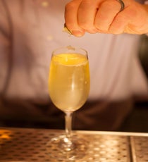 Step 4: Garnish by squeezing finger lime caviar into the flute. 18_042_Cocktail#2_Lime_Steps
