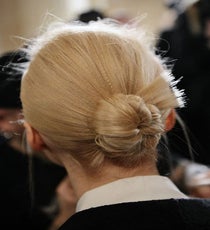 At Zac Posen, hairstylist Guido (working with John Frieda products) created a "lightly frizzed effect" by using a small crimping iron, then brushing the hair out before winding into a chignon. The result: a seemingly polished style that's classic, but not prim.
Photographed by Nina Westervelt/MCV Photo zac-posen-photoshop