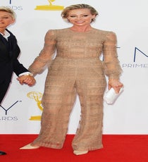 We don't know too many people who can pull off a beige, sheer pantsuit like itty-bitty Portia de Rossi! It certainly helped that it was rendered by the house of Valentino, which does lace like nobody's biz. Polished like a pro, and with Ellen by her side, she stood out from her peers looking effortless and fresh — even in a nude hue. Photo: Matt Baron/BEImages emmys-dresses-portia-di-rossi