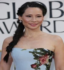 Lucy Liu
We love Lucy. While her dress may be slightly controversial (we personally landed that Carolina Herrera masterpiece firmly on our Best Dressed List), her insanely gorgeous twisted-and-woven braid is a total and definite win. Created by Wella celebrity stylist Andy LeCompte, this "perfect imprefection" braid helps create a stunning counterbalance to that lush, Marie-Antoinette-inspired dress. Heck, we might go as far as to say it's one of the best braids ever executed on a red carpet. Too much? Nah, we say she can have it, and you can quote us on that.
Photo: Rex/Rex USA golden-globes-beauty-lucy-liu