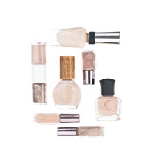 Nudist Colony
We know, we know: Nude nail polish as a trend is not exactly earth-shattering news. It's been around since what feels like the dawn of time (or at least the dawn of nail polish), but what strikes us as unique this season is the way it's being used. As nail art fatigue starts to settle in, many nail artists turned to simpler nude and earthy hues for nails, throwing in some fun metallic finishes for added interest. The array of tans, browns, and cocoas hitting shelves this month is mind-boggling.
Sally Hansen Complete Salon Manicure in Almost Almond, $7.99, available at CVS; Urban Decay Naked Nail Set in Toasted, Sidecar, and Naked, $26, available at Sephora; Deborah Lippmann Nail Color in Careless Whisper, $17, available at Deborah Lippmann; Sheswai Lacquer Nail Lacquer in For Real, $16, available at Beautyhabit; Revlon Nail Art Expressionist Nail Enamel in Silhouette, $8.99, available at Drugstore.com. spring-nails-nude