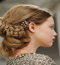 Of the four (yes, four) incredible hair looks at Oscar de la Renta, this messy, jewel-encrusted look has to be our favorite. This romantic, wispy, woven texture, accented with clusters of huge jewels, is opulence made casual enough for the street.
Photo: Nina Westervelt/MCV Photo OLDR-photoshop