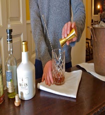 Add ice to a mixing glass. Pour in the port, Cognac, and Chartreuse and stir. 09_Step-2_1