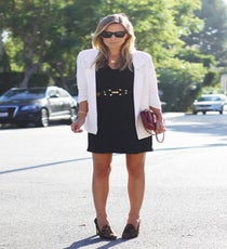 Jacey, Damsel In Dior
Although she doesn't own a lick of Dior, this Texas native is no stranger to designer duds. But, rather than sport ultra-luxe items from head to toe, she mixes in budget-friendly brands like Forever21 and H&M. In short, her blog is the perfect blend of cheap and chic!
In Her Words: "Nothing beats the rich mix of black against white, and whoever said you can't wear white after Labor Day was living under a rock. Being in Los Angeles during the fall season, you will be cold one minute and sweating the next, so a light blazer is key for transitioning into cooler months. A leopard heel and deep burgundy clutch push this look into the autumn direction even more, and a few pops of gold jewelry add warmth."
James Perse Dress, Forever21 Blazer, BCBG Belt, Chanel Clutch, Stuart Weitzman Shoes, Gorjana Necklace, Cartier Bracelet, Céline Sunglasses
Photo: Courtesy of Damsel In Dior damsel-in-dior-5