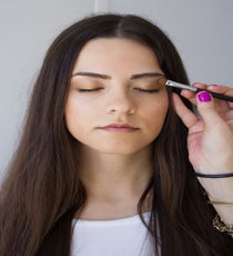 Step 5: Line the eyes under the lower lash line with golden eye pencil. This should be a bit smudgy and smoldering. Repeat on the upper lash line.
Step 6: Next, take a bold copper bronze shadow and apply to the upper lid all the way to the crease. Then take a true gold shadow and blend it into the crease of the eyelid. Sweep a light pink gold on the top part of the lid up to the brow line and blend away any hard lines.
Photographed by Christine Ting 07-Step4-2