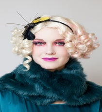 Add a jewel-tone stole, matching blouse, a cotton-candy colored wig, and a fascinator. Now, you've nailed the over-the-top amazingness that is Effie Trinket. 16_HalloweenLook1_091512_586