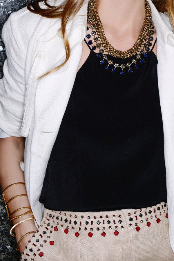 Palermo shows off one of her statements — a layered statement necklace. This one is by Lulu Frost.